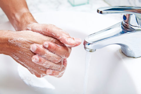 person washing their hands