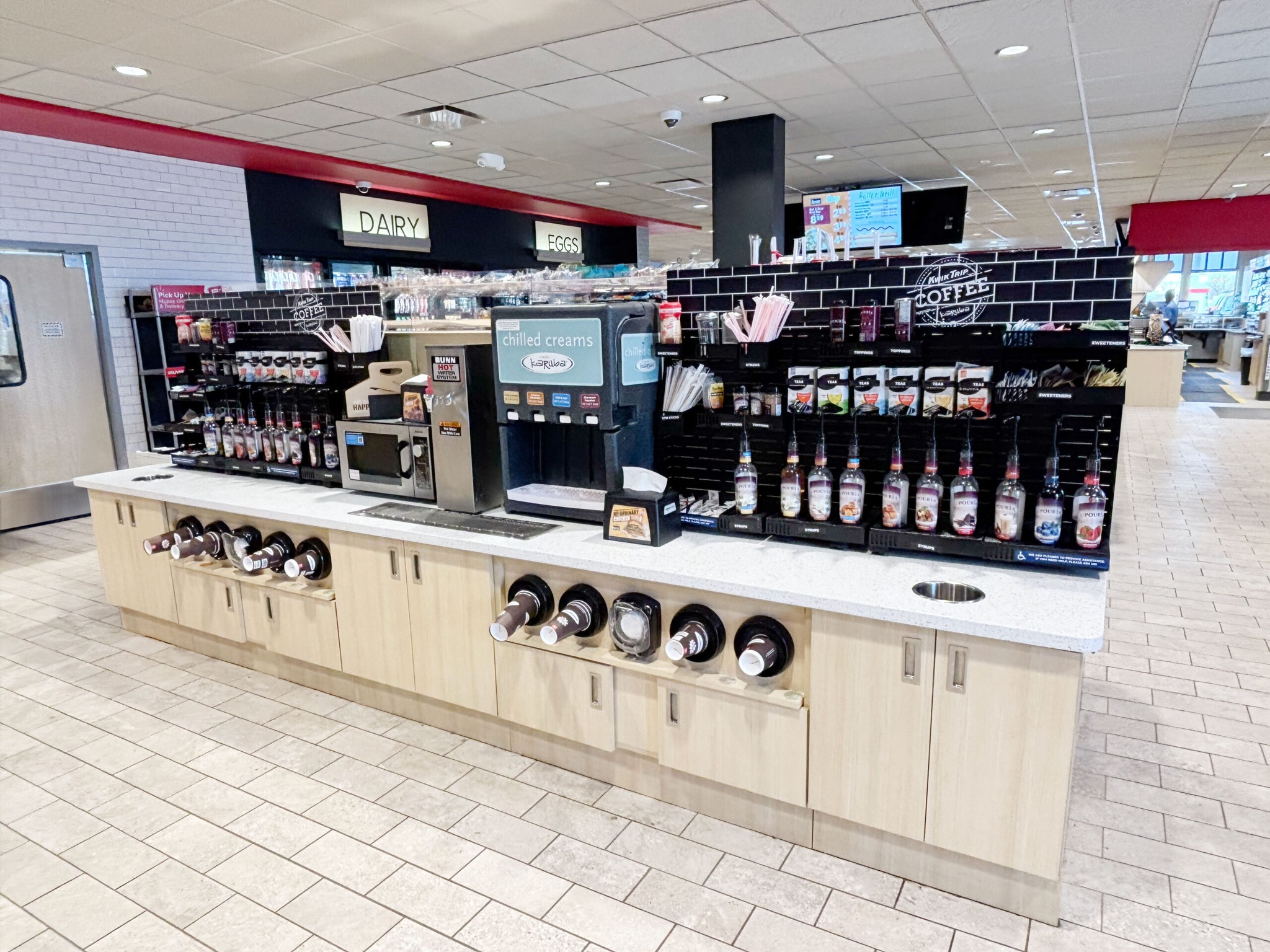 convenience store coffee station with impulse merchandising and customer decision zone